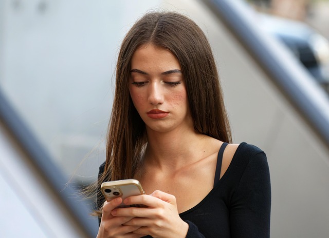attractive brunette woman using smartphone