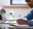 man with laptop and notebook