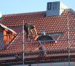 man working on roof
