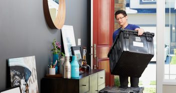 man moving stuff in house