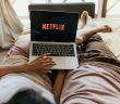netflix on laptop in bed
