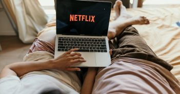 netflix on laptop in bed