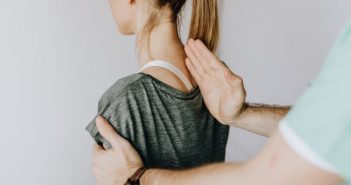 Comprehensive Approaches to Treating Spinal Disorders woman getting back examination