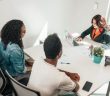 couple with loan officer at bank