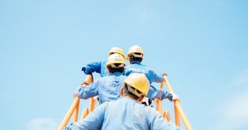 construction workers walking up steps