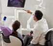 dentist with patient review x-ray