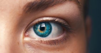 closeup of woman's blue eye and eyeleash