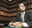 lawyer in room with legal books