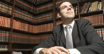 lawyer in room with legal books