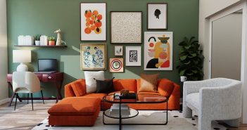 orange sofa in living room with framed art on the green wall