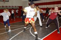 man leading fitness class in gym