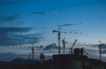 cranes on building contruction at dusk