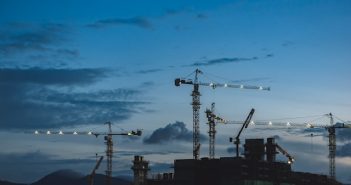 cranes on building contruction at dusk