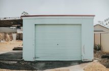 small car garage with ugly light green paint