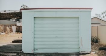 small car garage with ugly light green paint