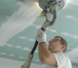 man working on ceiling