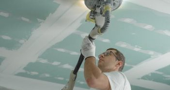 man working on ceiling