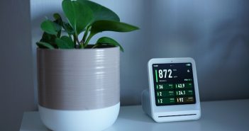 plant and electronic device on table