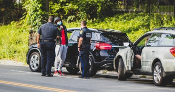 drivers and police at scene of car accident