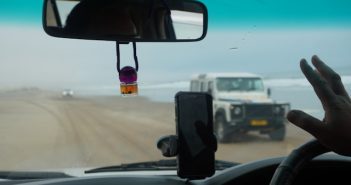 view through windshield from moving car