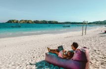 man on the beach with laptop