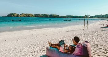 man on the beach with laptop