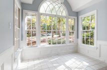 large room in home with large white windows