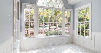 large room in home with large white windows