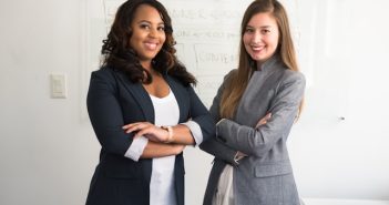 two women in suits