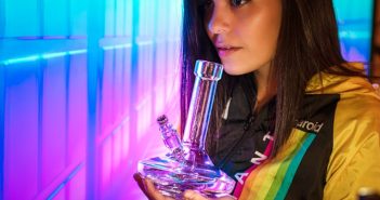 pretty brunette woman holding bong