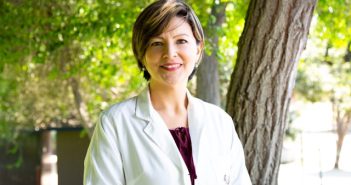 woman in white lab coat