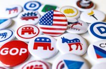 political buttons spread out on table