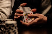 close-up of hands shuffling cards