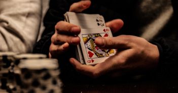 close-up of hands shuffling cards