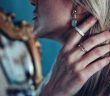 close-up of attractive blonde woman wearing jewelry