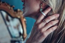 close-up of attractive blonde woman wearing jewelry