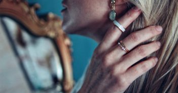 close-up of attractive blonde woman wearing jewelry