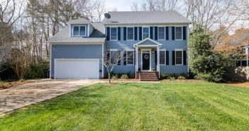 blue house with large front lawn