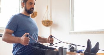 man in blue shirt exercising