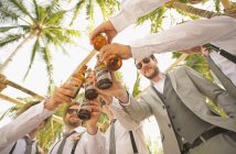 groom and groomsmen toasting