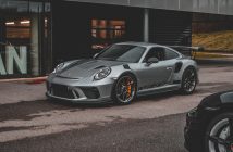light gray Porsche sports car parked in street