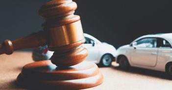 wooden gavel with toy cars