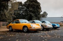 classic prsche sports cars in yellow gray and blue