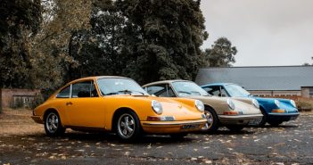 classic prsche sports cars in yellow gray and blue