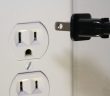 electrical outlet and plug about to be put in