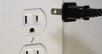 electrical outlet and plug about to be put in