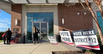 woman entering voting area