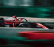 red Formula 1 car on course