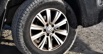closeup of car tire and rims