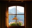 hanging lamp in front of windo in dark room